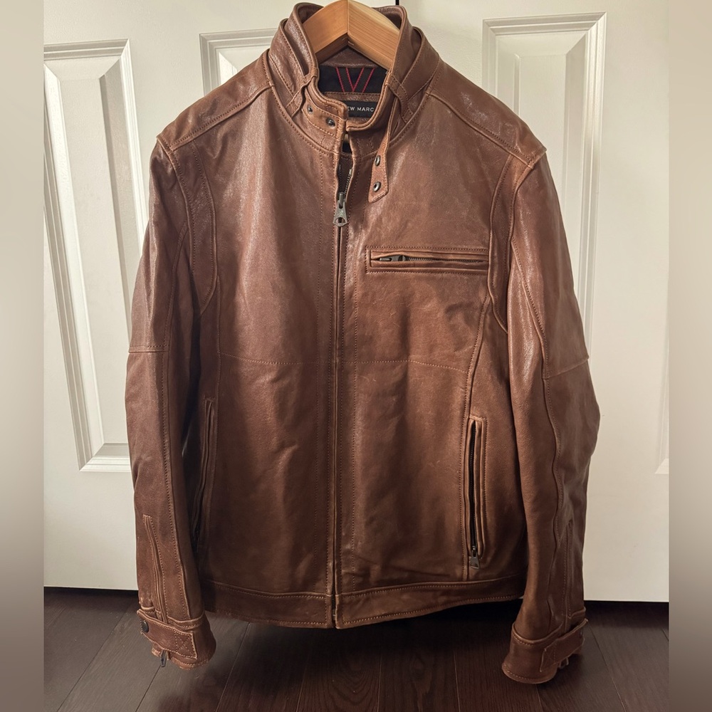 Warm brown Andrew Marc leather bomber jacket.
